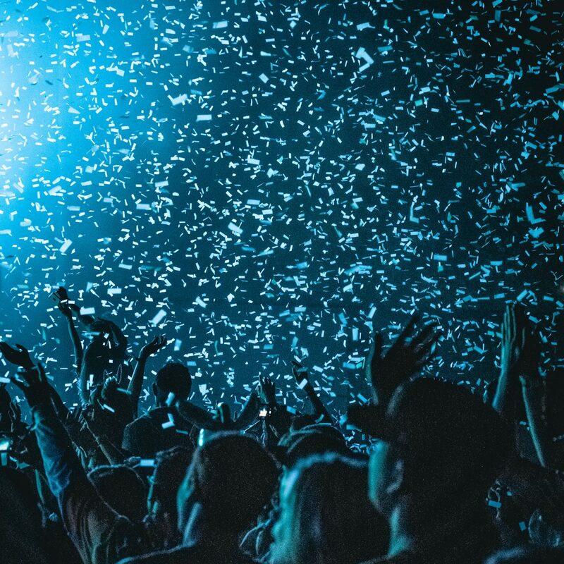 Confetti dropping over a Dubai nightclub crowd