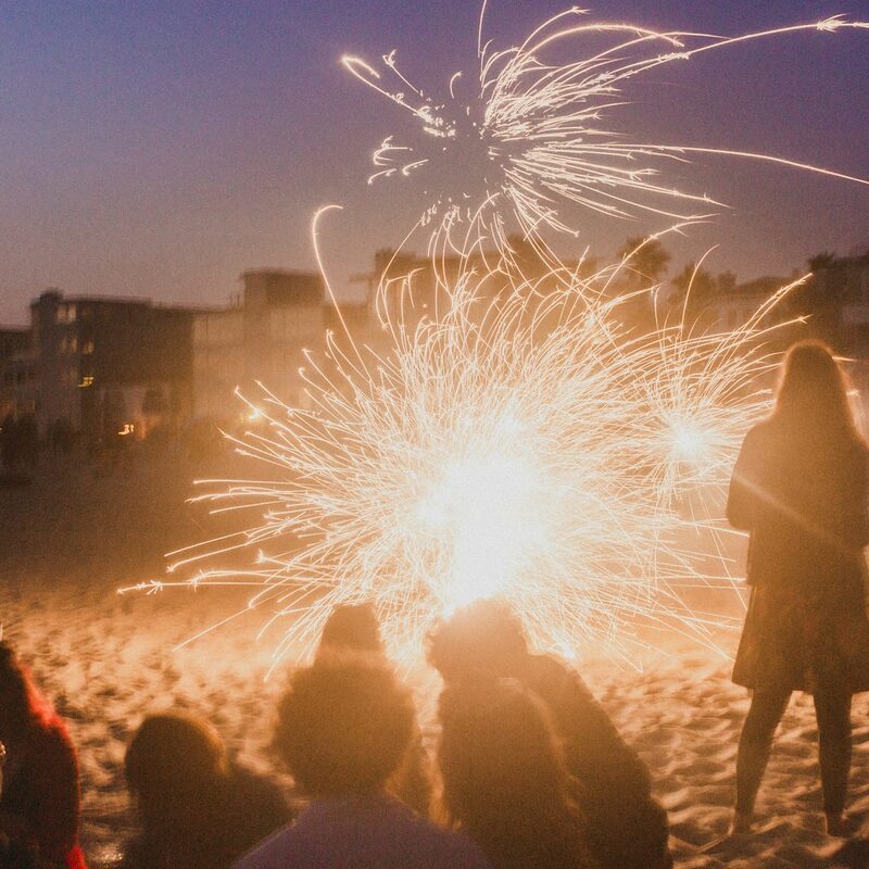 Beach party with sparklers at night in Dubai